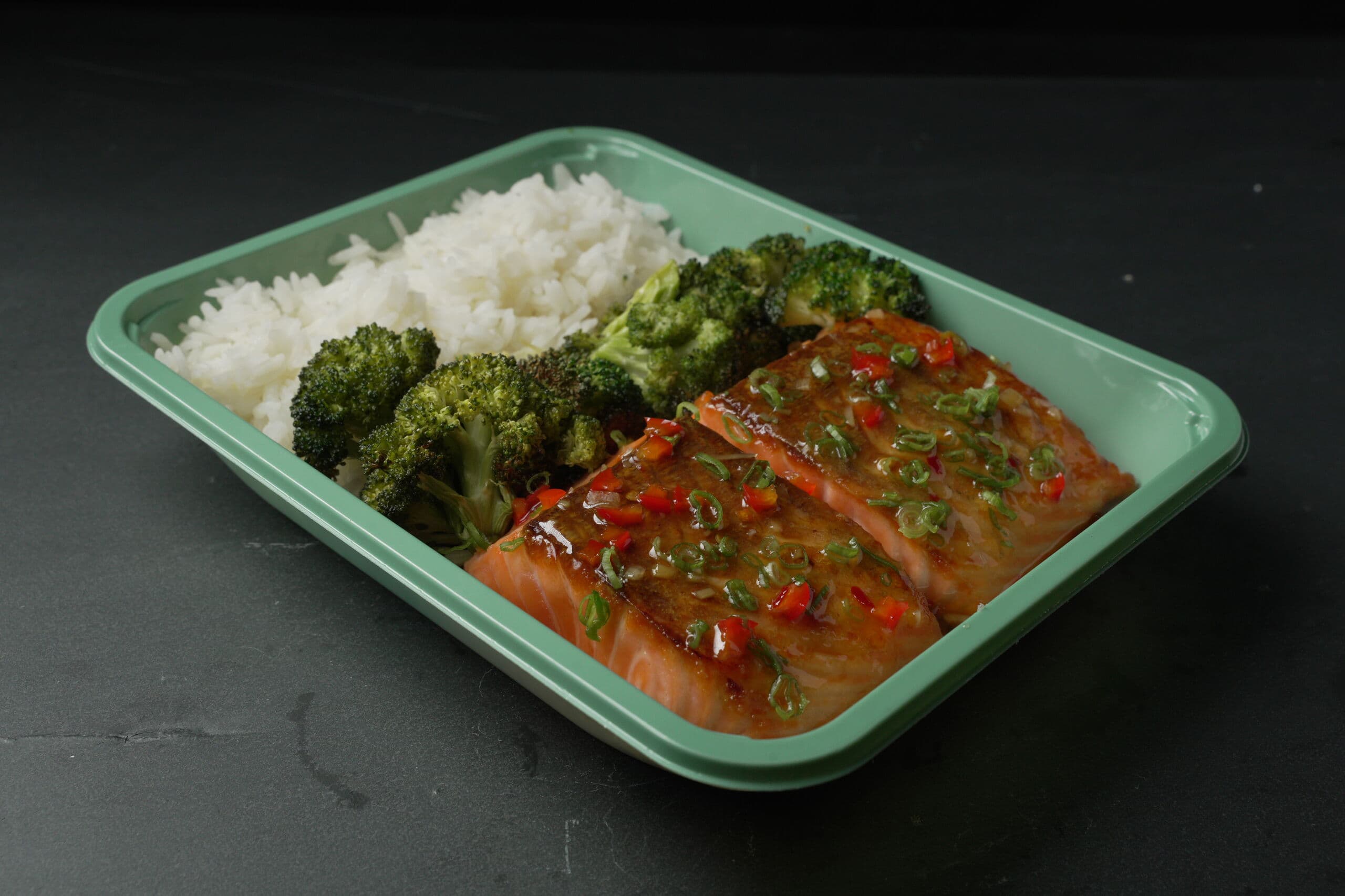 ABLTY youth performance tray with glazed salmon, jasmine rice, and roasted broccoli