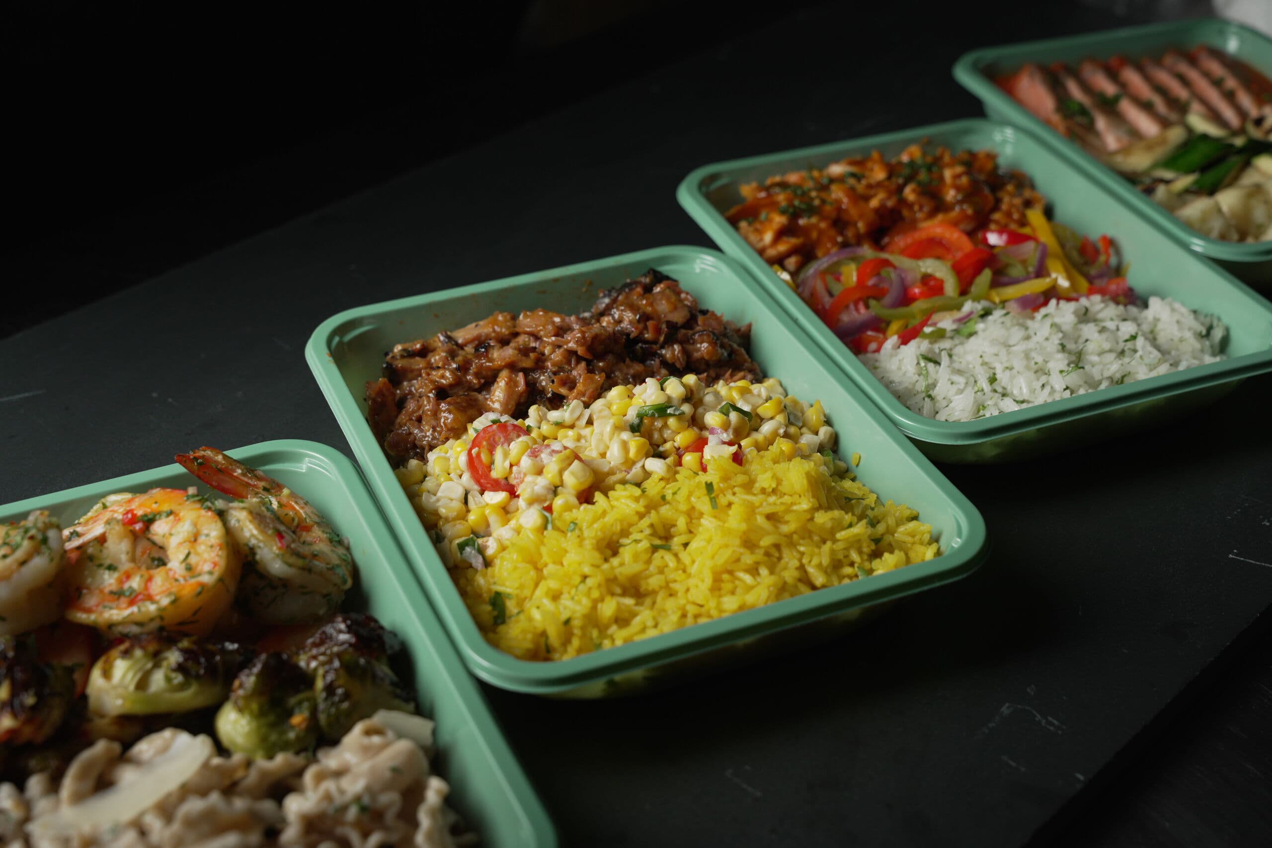 A line of ABLTY performance meal trays coming off the pass in the Washington DC commissary